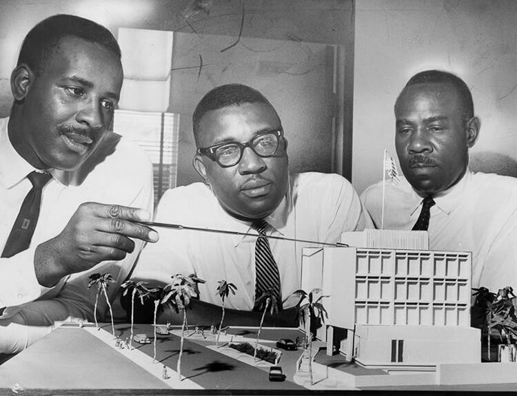 The Madison brothers team -- from left, Bernard, Julian and Robert -- work on a presentation model of the U.S. Embassy in Dakar, Senegal, in the 1960s