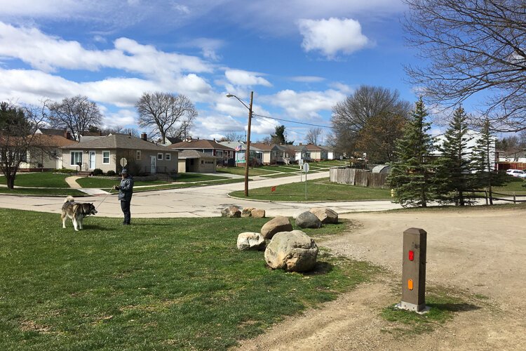 Adjacent to a quiet residential neighborhood, Center Park in Parma houses a trailhead for the West Creek Reservation.