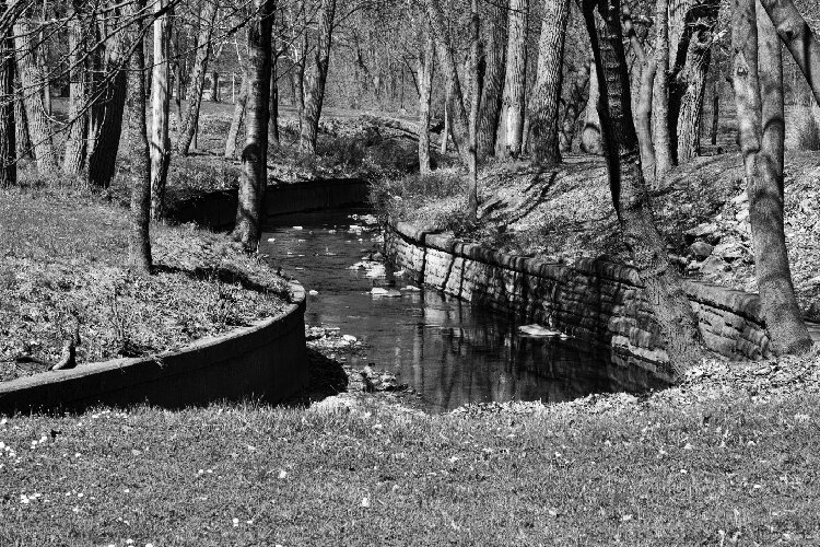 <span class="content-image-text">Doan Brook, as it winds through Rockefeller Park, is constrained by stone walls funded by the WPA.</span>