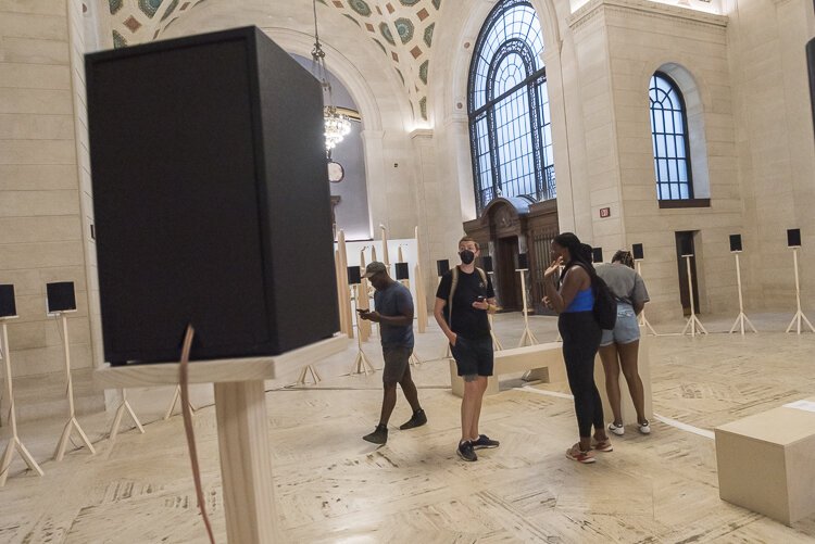 Jace Clayton’s “40 Part Part,” consisting of 40 audio speakers arranged in a circle where one can plug their mobile devices and upload a favorite tune.