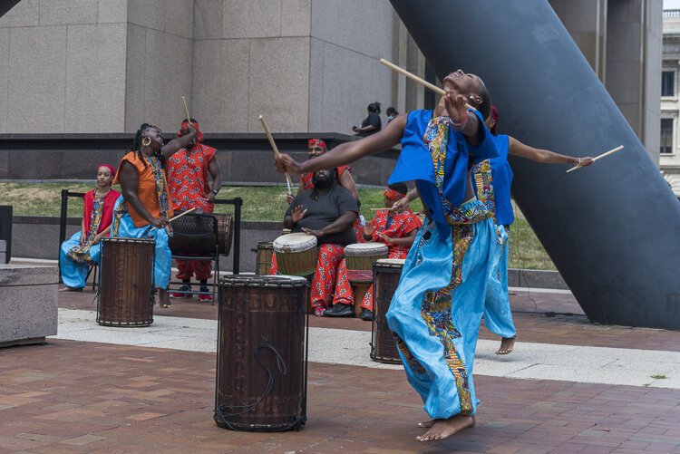 Caption: FRONT Djapo Cultural Arts Institute at the Isamu Noguchi sculpture, “Portal,” at The Justice Center