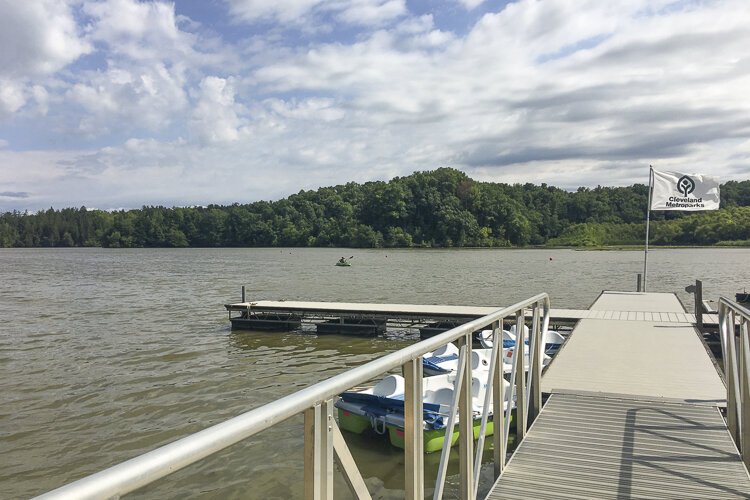 A lone kayaker explores Hinckley Lake.