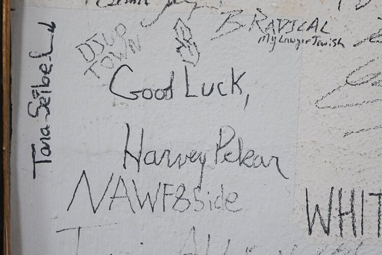 <span class="content-image-text">Harvey Pekar's signature is one of many over the years on the walls at Revolution Records</span>