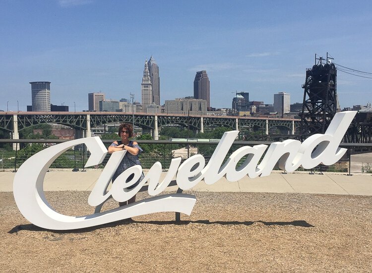 <span class="content-image-text">Lisa Ligus at the Cleveland sign in Tremont.</span>