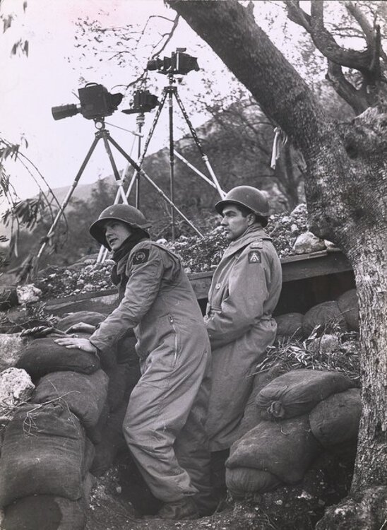 <span class="content-image-text">Life photographer Margaret Bourke-White prepares to photograph an air battle on the Italian front during World War II, 1943</span>