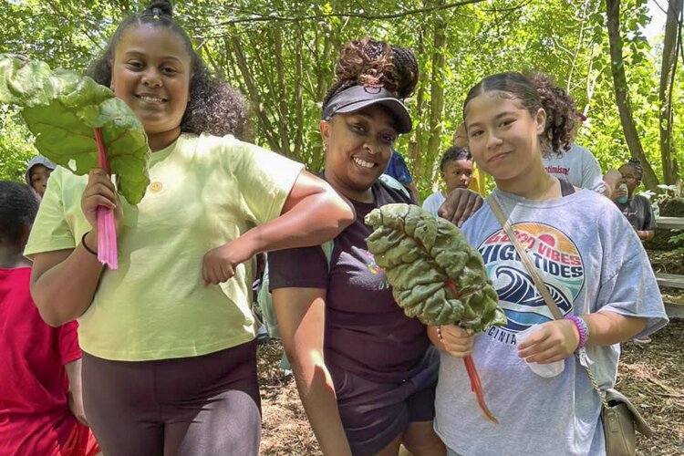 50 students from Save Our Children Elyria were at Spice Acres before the July 4 holiday to tour the farm and harvest produce from the Learning Garden.