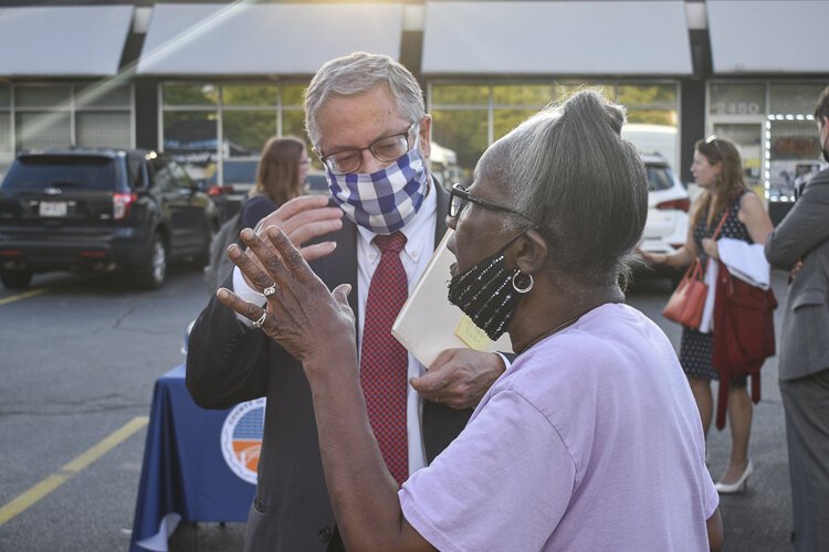 County Executive Armond Budish speaks to a resident during the event in the Central neighborhood in mid-August 2021