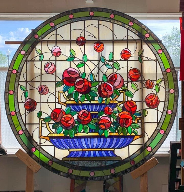 A mix of the original and custom stained glass was installed in the rose window.
