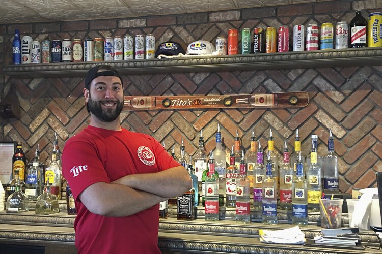 Max is at the ready behind the bar at Whiskey Island Still & Eatery
