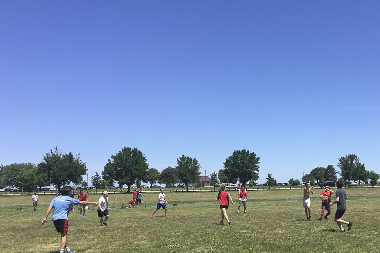 Frisbees flying on Father's Day 2022 at Edgewater.