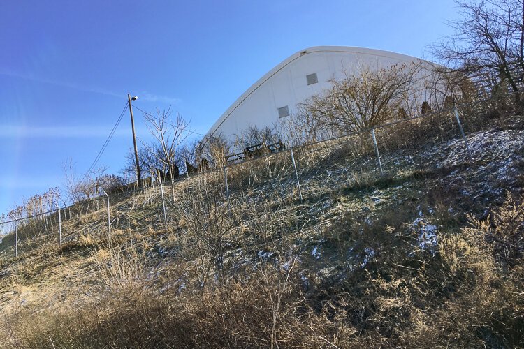 A structure overlooks the trail.