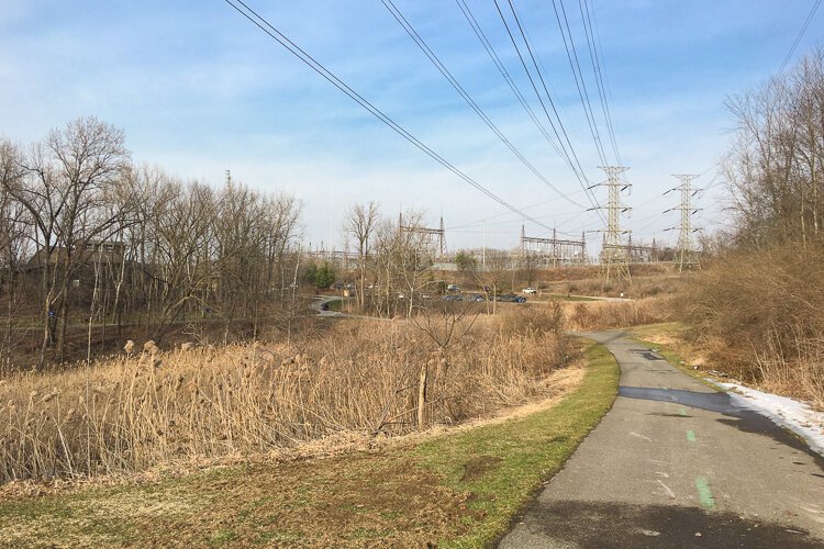 The expansive high voltage transmission line infrastructure holds court over the park.