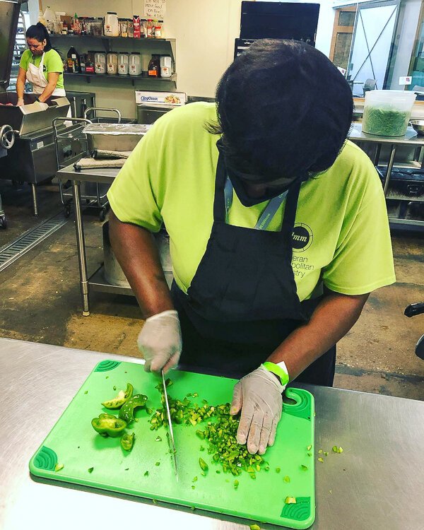 <span class="content-image-text">Culinary student working in the kitchen.</span>