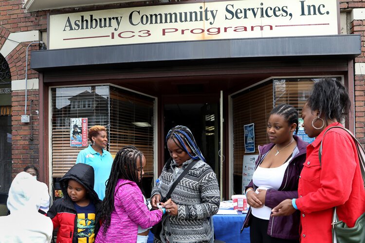 Mother and kids visit CLC block party