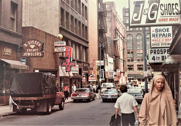 <span class="content-image-text">When E. 4th Street was Fourth Street where Otto Moser's can be seen on the left.</span>