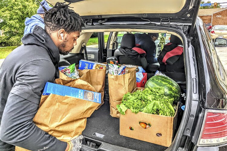 <span class="content-image-text">Garden Valley Neighborhood House food pantry distribution</span>