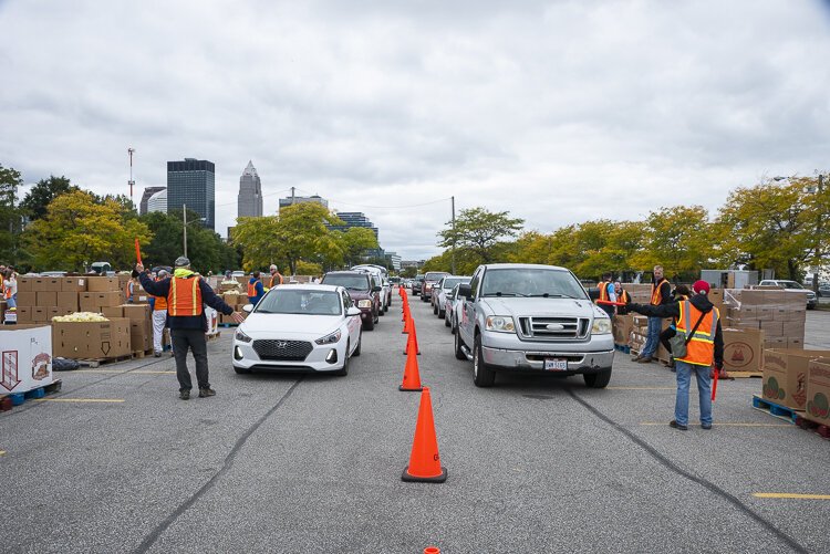 A long line of cars for the Cleveland Food Bank Mobile Pantry Program at the City of Cleveland Muni Lot