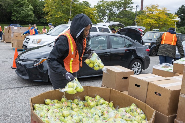 <span class="content-image-text">Volunteers help distribute food at the Cleveland Food Bank Mobile Pantry Program at the City of Cleveland Muni Lot</span>