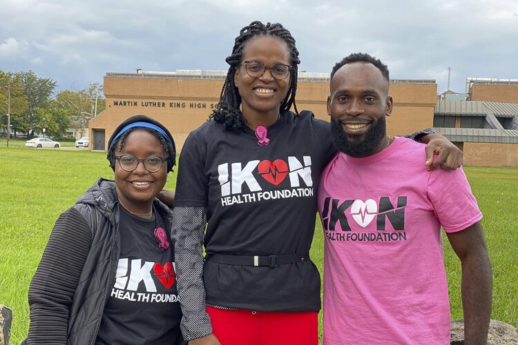 John “Ikenna” Ogwuegbu, right, founder of Ikon Health foundation, works with volunteers to provide high-quality health care in underserved areas- both in Cleveland and in Africa.