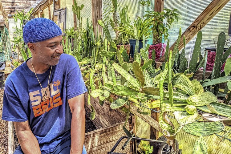 Keymah Durden, co-founder of Rid-All Green Partnership, which raises produce and tilapia in hoophouses heated up to 100 degrees Fahrenheit