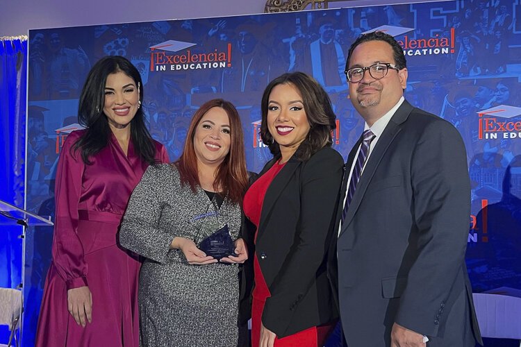 Esperanza receiving the Excelencia award in D.C.