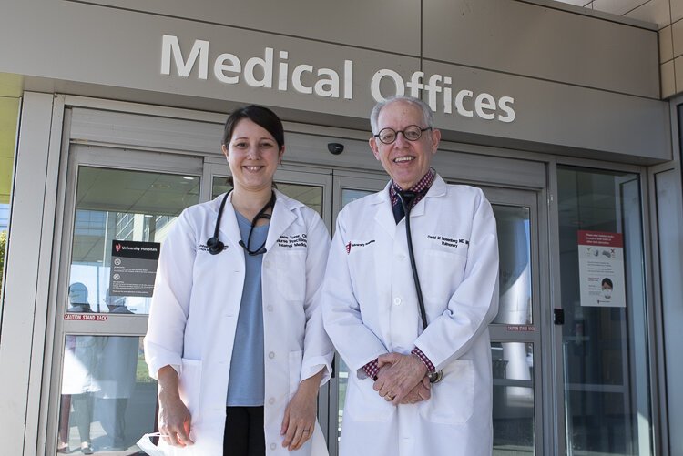 UH COVID Recovery Clinic medical director David  Rosenberg and staff member Juliane Torer, Internal Medicine Nurse Practitioner outside University Hospitals COVID Recovery Clinic in the Risman Pavilion