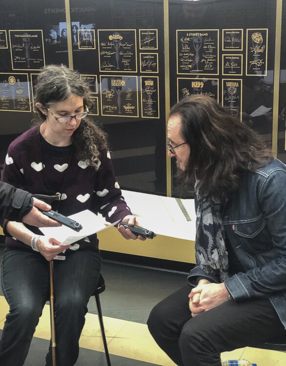 Annie interviewing rush’s Geddy Lee at the Rock Hall