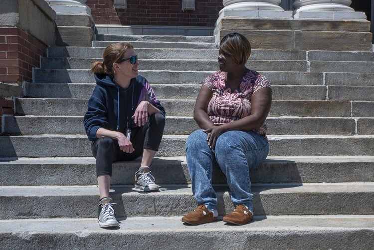 Stephanie Thomas (left), city neighborhood street outreach worker at the nonprofit, assisted Shear King (right) in applying for the Rapid Rehousing Program