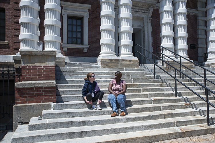 <span class="content-image-text">Stephanie Thomas, scene here with Shear King (right), does housing intake every Tuesday at Cleveland Public Library West Branch.</span>