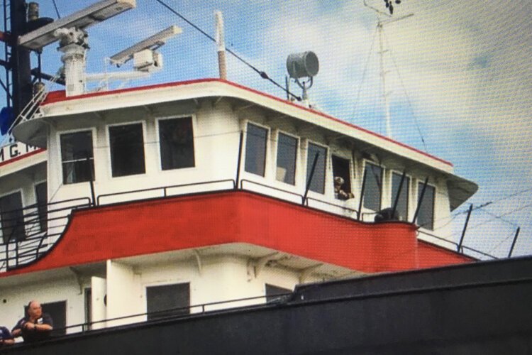 Harry Anderson in the in the pilothouse window of the William G. Mather which he commanded for several years in the mid 1960s