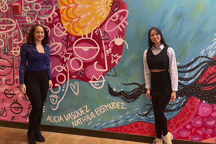 Local artists Alicia Vasquez and Nathalie Bermudez with their mural reflecting Playhouse Square’s 100th anniversary theme “Together We Shine”