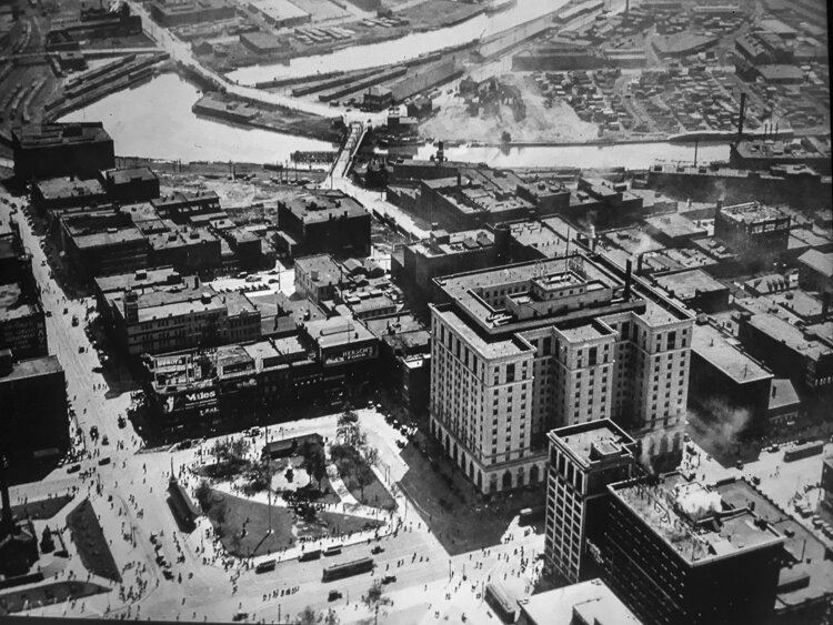 Champlain St. runs east/west in the middle of this image from around 1922-23