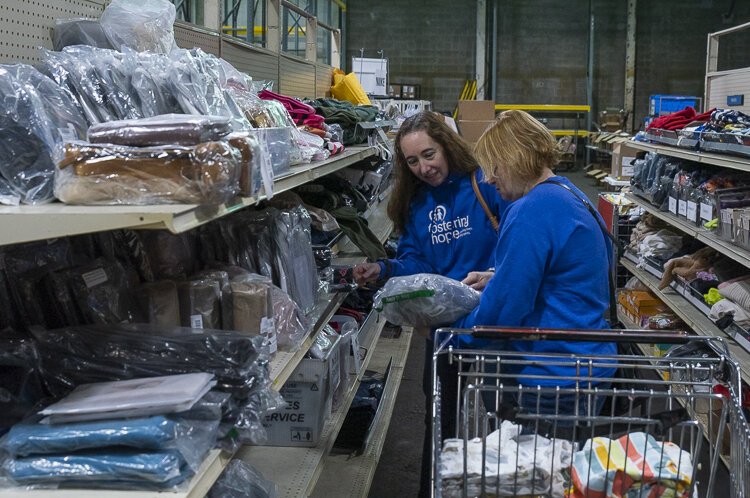 Corie Friedman and Ashley Fisher from Fostering Hope looking for good at the Goods Bank NEO