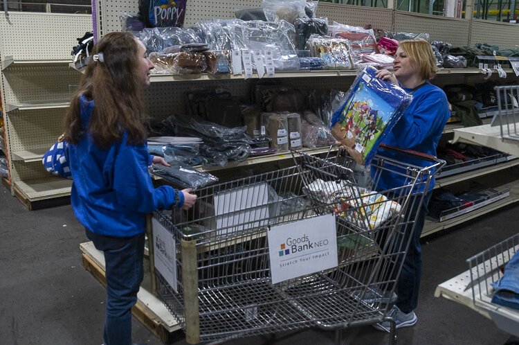 <span class="content-image-text">Corie Friedman and Ashley Fisher from Fostering Hope looking for good at the Goods Bank NEO</span>