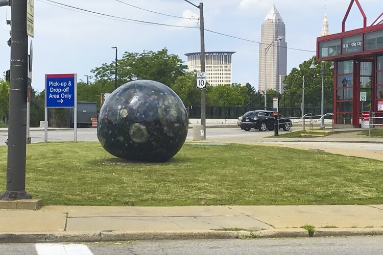 "They Have Landed" orb sculpture after it was resurfaced in 2019