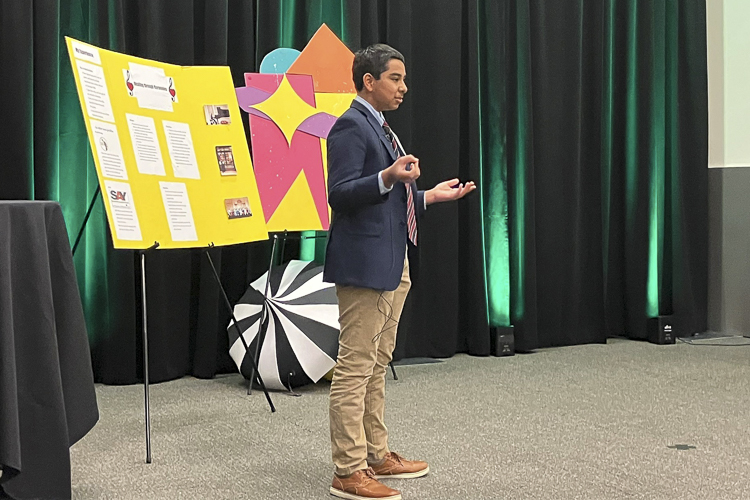 Teen Accelerate 2023 runner-up Anshul Sharma of Healing Through Harmonies giving his presentation