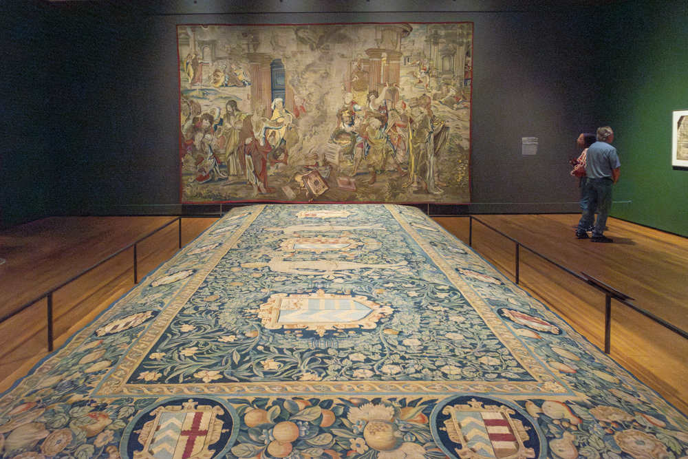 The Lewknor Table Carpet (foreground) with Saint Paul Directing the Burning of the Heathen Books in the background