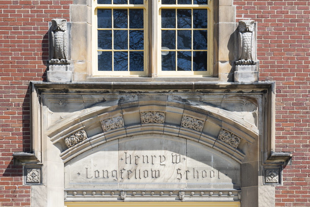 Exterior detail of The Longfellow apartments showing some of the architectural detail from the old school