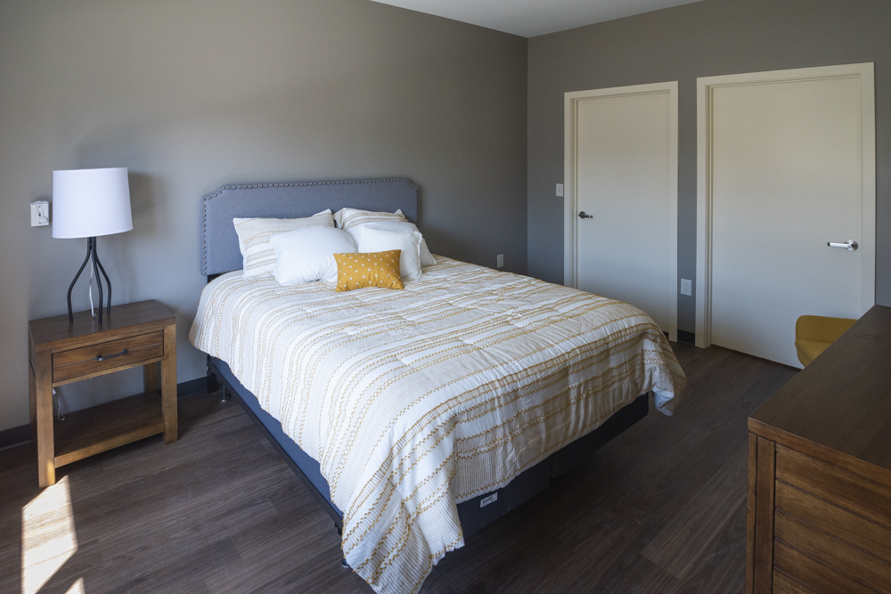 A bedroom in the new section of The Longfellow apartment complex