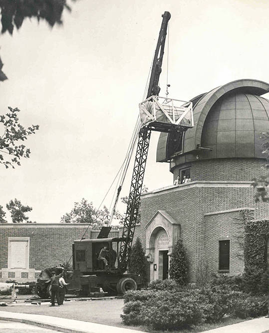 The Schmidt being installed in its new dome at the Warner and Swasey Observatory