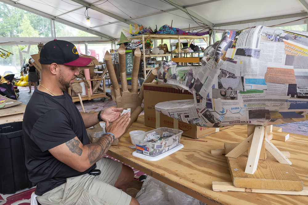 Erik Melendez of the Hispanic Police Officers' Association works on their float for the Parade