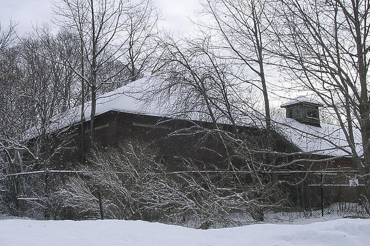 The original Longwood stables, tucked into the wooded outskirts of the Severance Mall property, are now used by the CH-UH Board of Education for storage