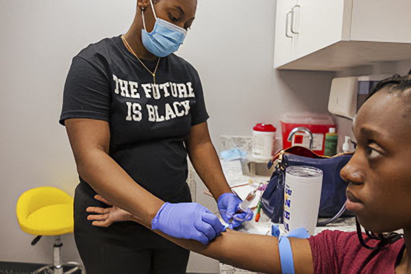 VOHC Nurse completing a blood draw