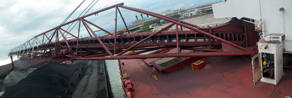 The iron ore is removed from the freighter’s hold via a conveyor belt and then transferred to shore on a 250-foot boom