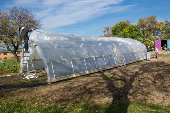 Carlton Jackson and Todd Alexander, co-owners of Tunnel Vision Hoops working on a hoop house in Ohio City