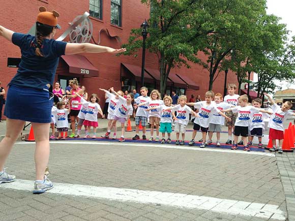 The 2013 Ohio City Kids Dash warm up prior to the 130 meter dash -  photo Ashley Taseff
