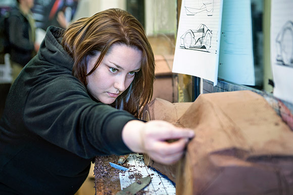 Current CIA senior Industrial Design student Jennifer Baugher making a clay model of a car she designed
