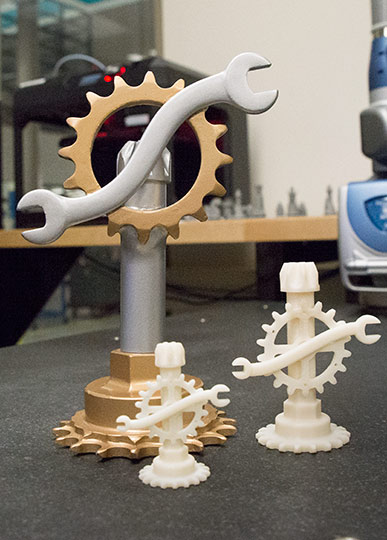 Original image and smaller 3-D printed versions