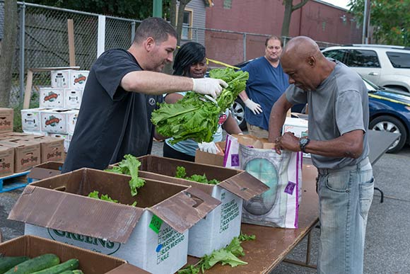 <span class="content-image-text">Weekly fresh produce distribution at The May Dugan Center</span>