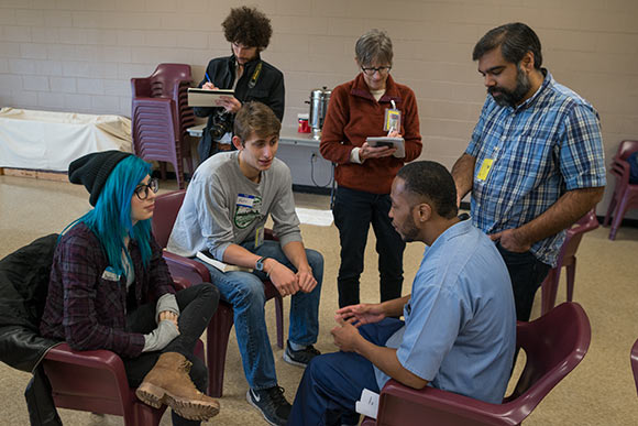 CWRU students and Inmates hold conversations and discussions amid breakout groups